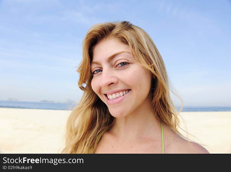 Beautiful Blond Woman Enjoying The Beach