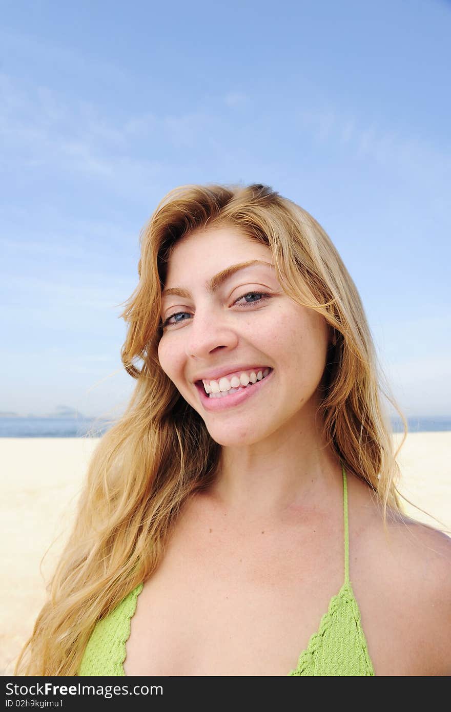 Beautiful Blond Woman Enjoying The Beach