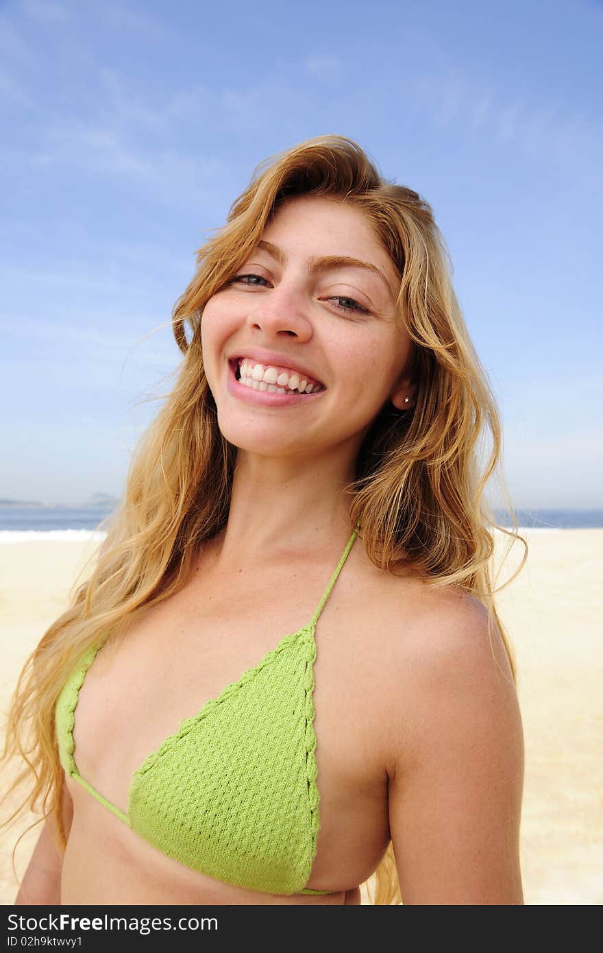 Beautiful Blond Woman Enjoying The Beach