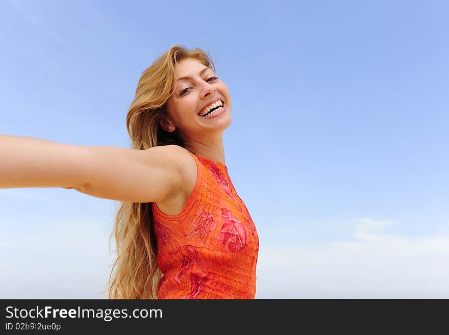 Happy  Blond Woman On The Beach