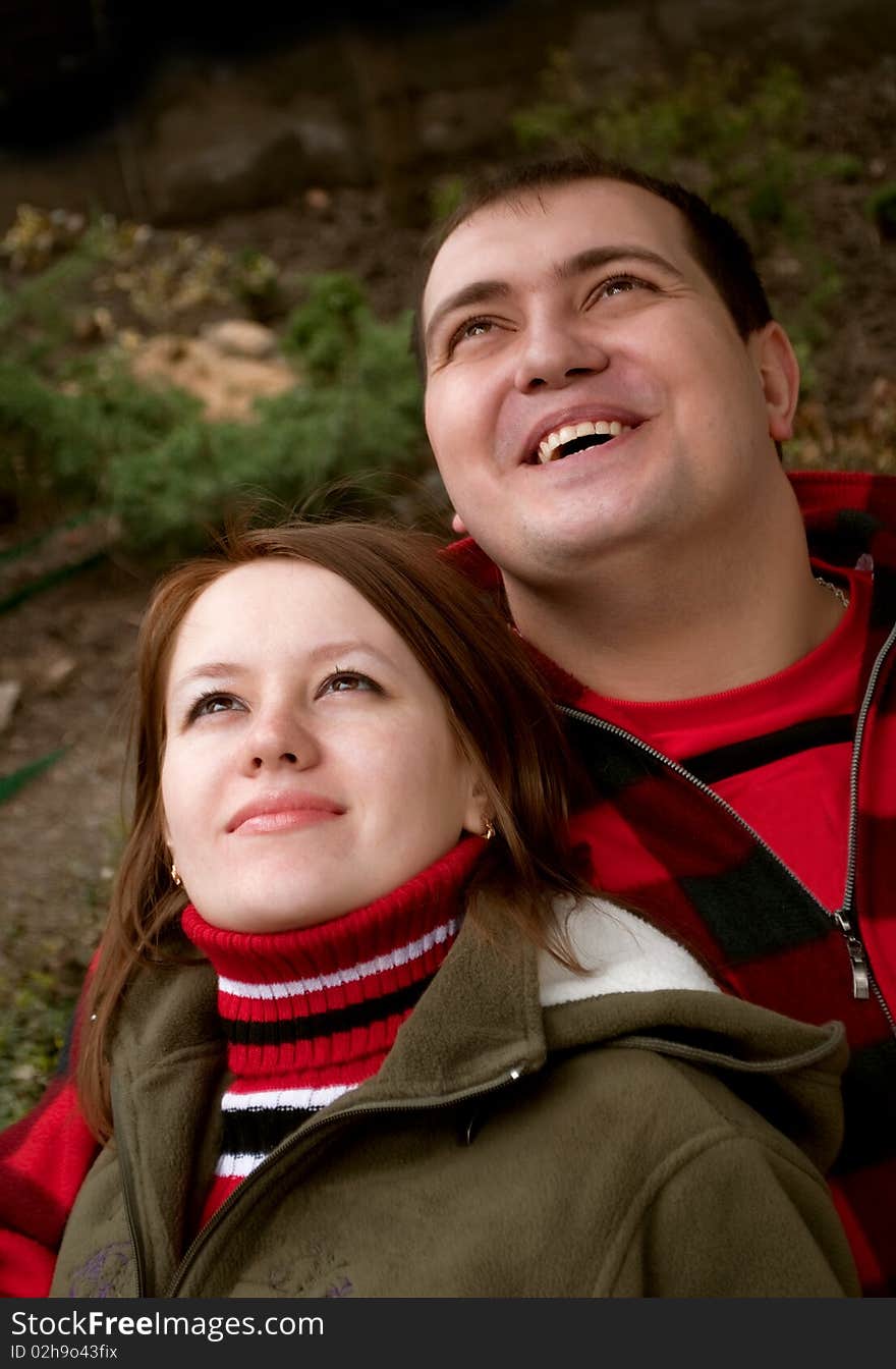 Young married couple looking up