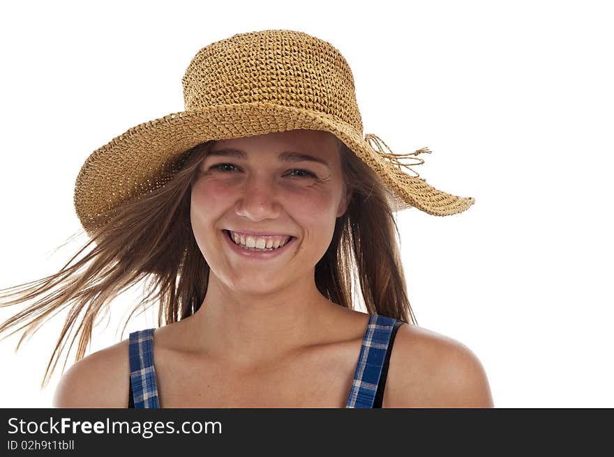 Pretty teen girl wearing an old straw hat. Pretty teen girl wearing an old straw hat