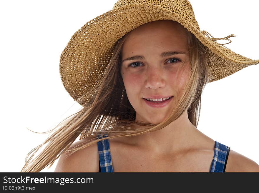 Pretty teen girl wearing an old straw hat. Pretty teen girl wearing an old straw hat