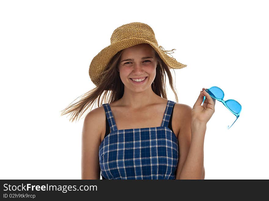 Pretty teen girl with blue sunglasses and a straw hat. Pretty teen girl with blue sunglasses and a straw hat