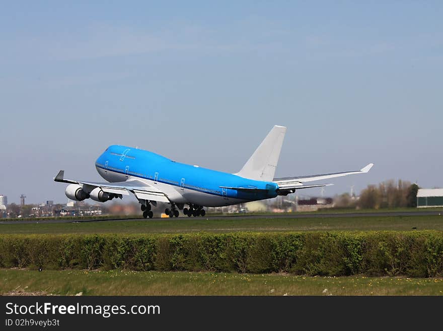 Big airplane taking off from runway