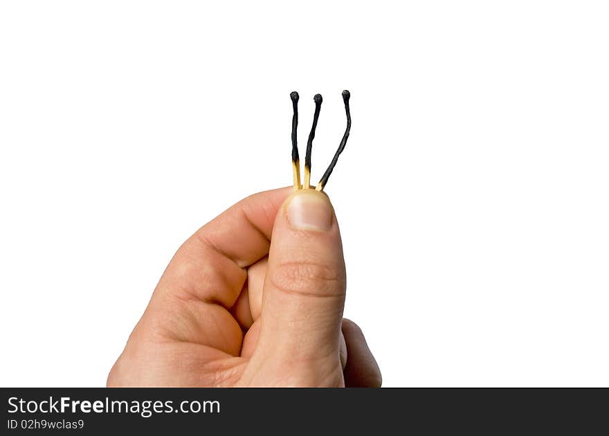 Hand holding 3 burnt out matches isolated on white background. Hand holding 3 burnt out matches isolated on white background