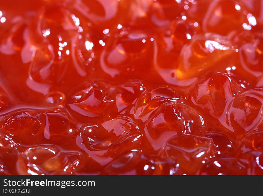 Red caviar as a background for design works.