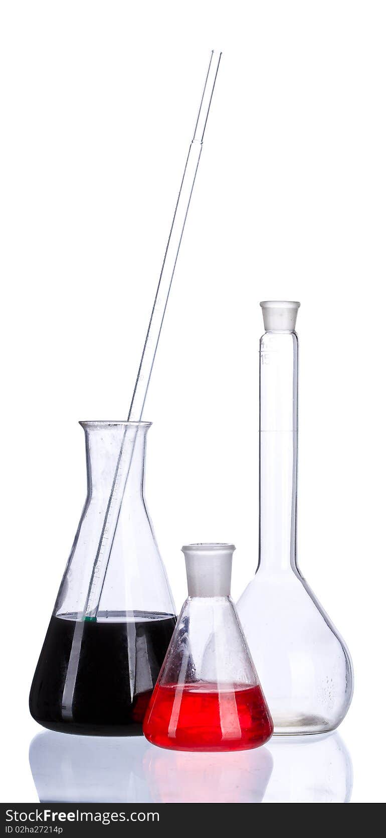 Chemical flasks with colored liquid & powder on a white background