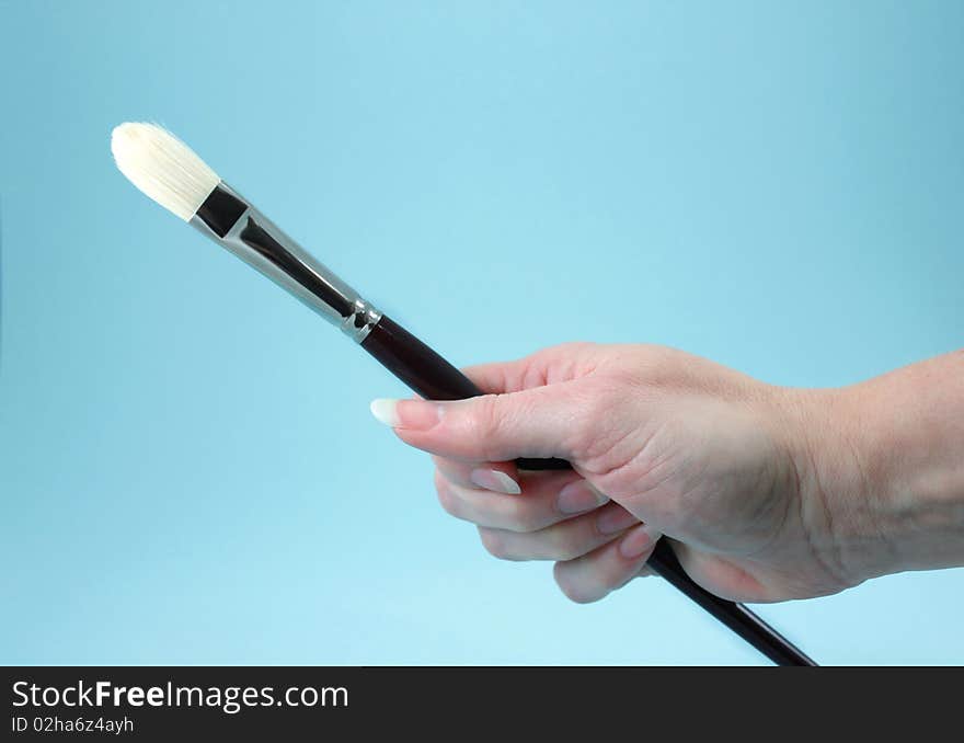 Hand and Artist Brush