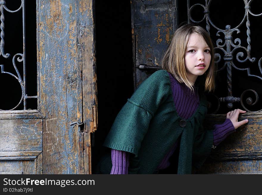 White child opening door from one home. White child opening door from one home