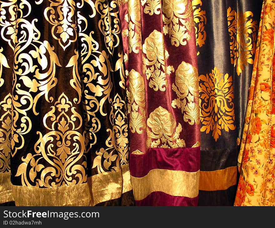 Colorful velvet fabric with golden foil design. Colorful velvet fabric with golden foil design.