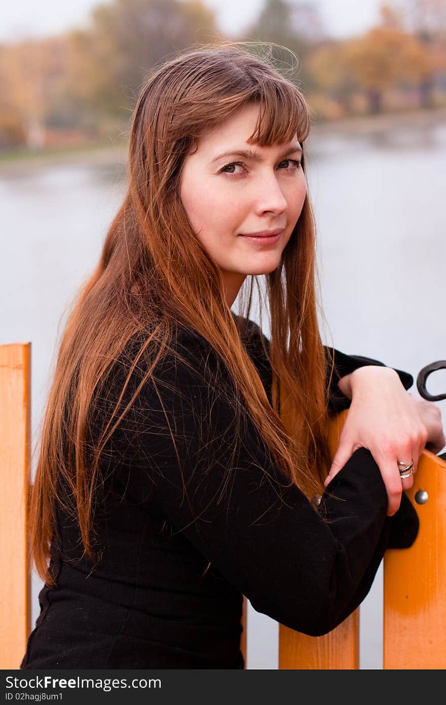 Portrait of lady in black dress in the park