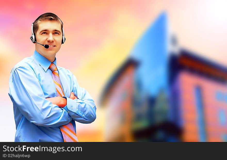 Happiness businessman in headphoness on the business architecture background