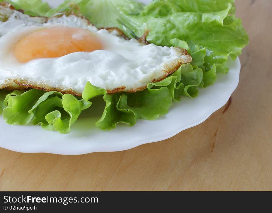 Breakfast eggs and fresh lettuce