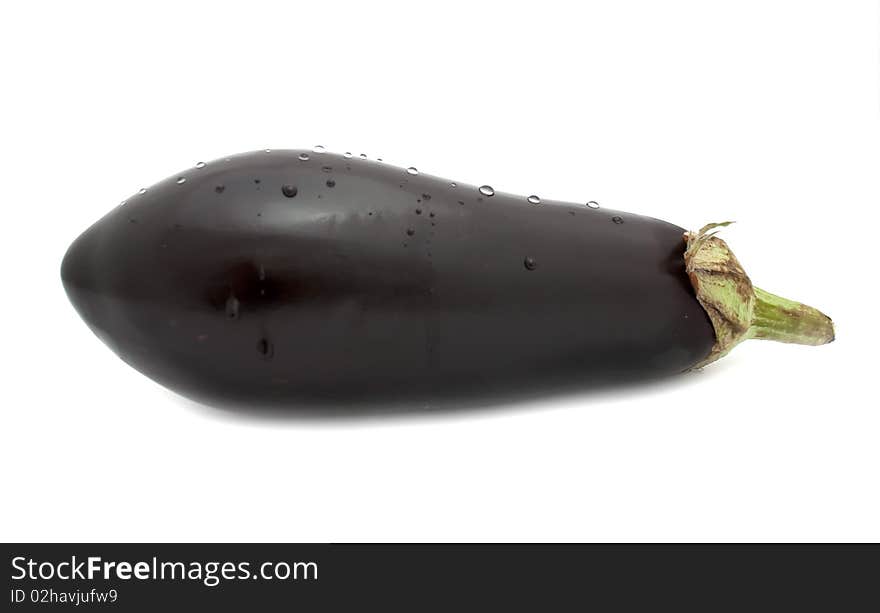 An aubergine with water drops isolated on a white background