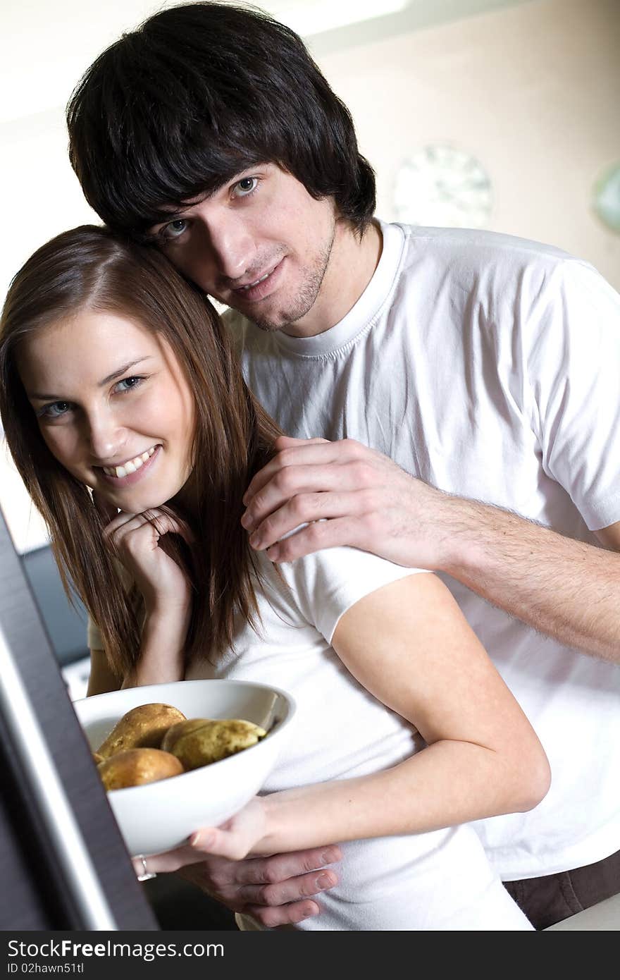 Boy with smile and nice long-haired girl with plate. Boy with smile and nice long-haired girl with plate