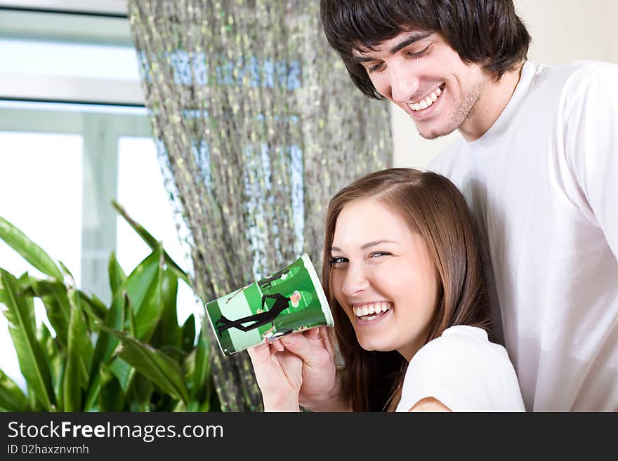 Nice girl with cup and boy with smile