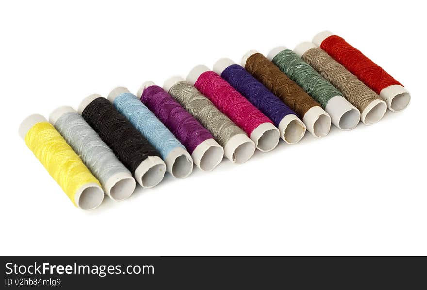 Set of colored spools of threads isolated on white. Set of colored spools of threads isolated on white