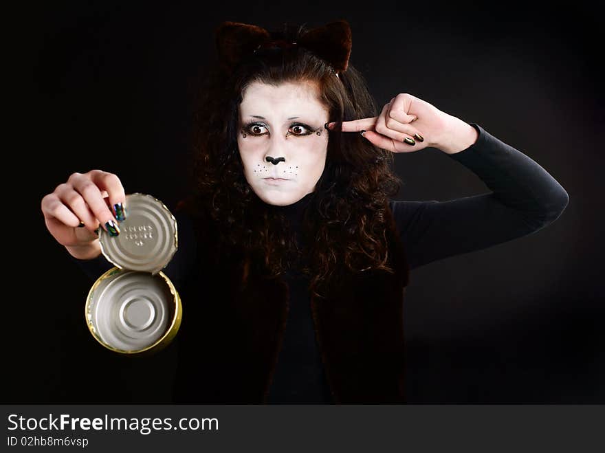 Portrait of cat-girl with an empty can. Studio shot. Portrait of cat-girl with an empty can. Studio shot.