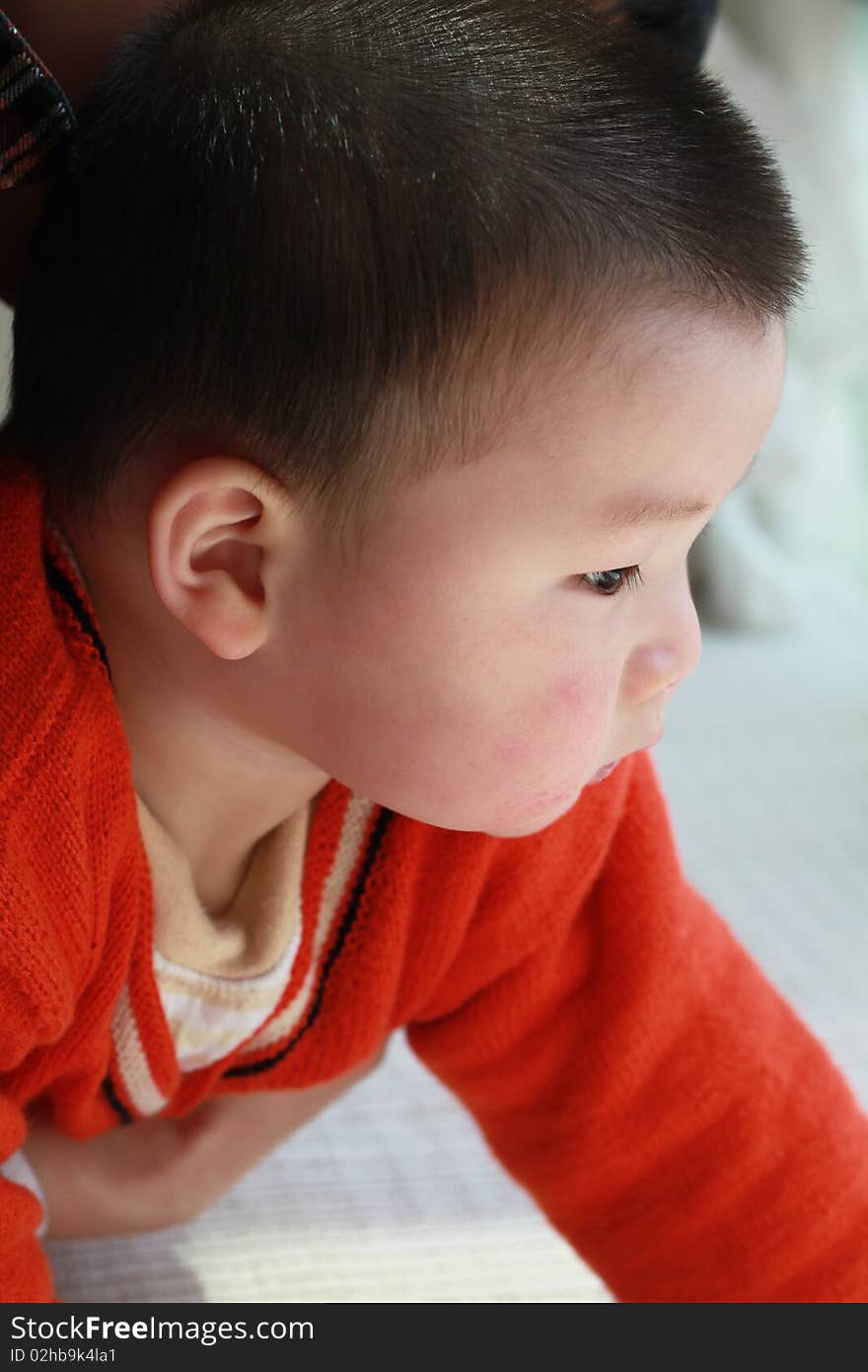 Lovely Chinese baby in the red coat. Lovely Chinese baby in the red coat