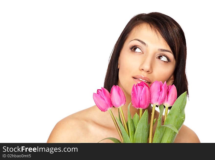 Beautiful naked shoulders female holding a bunch of pink tulips isolated on white. Beautiful naked shoulders female holding a bunch of pink tulips isolated on white