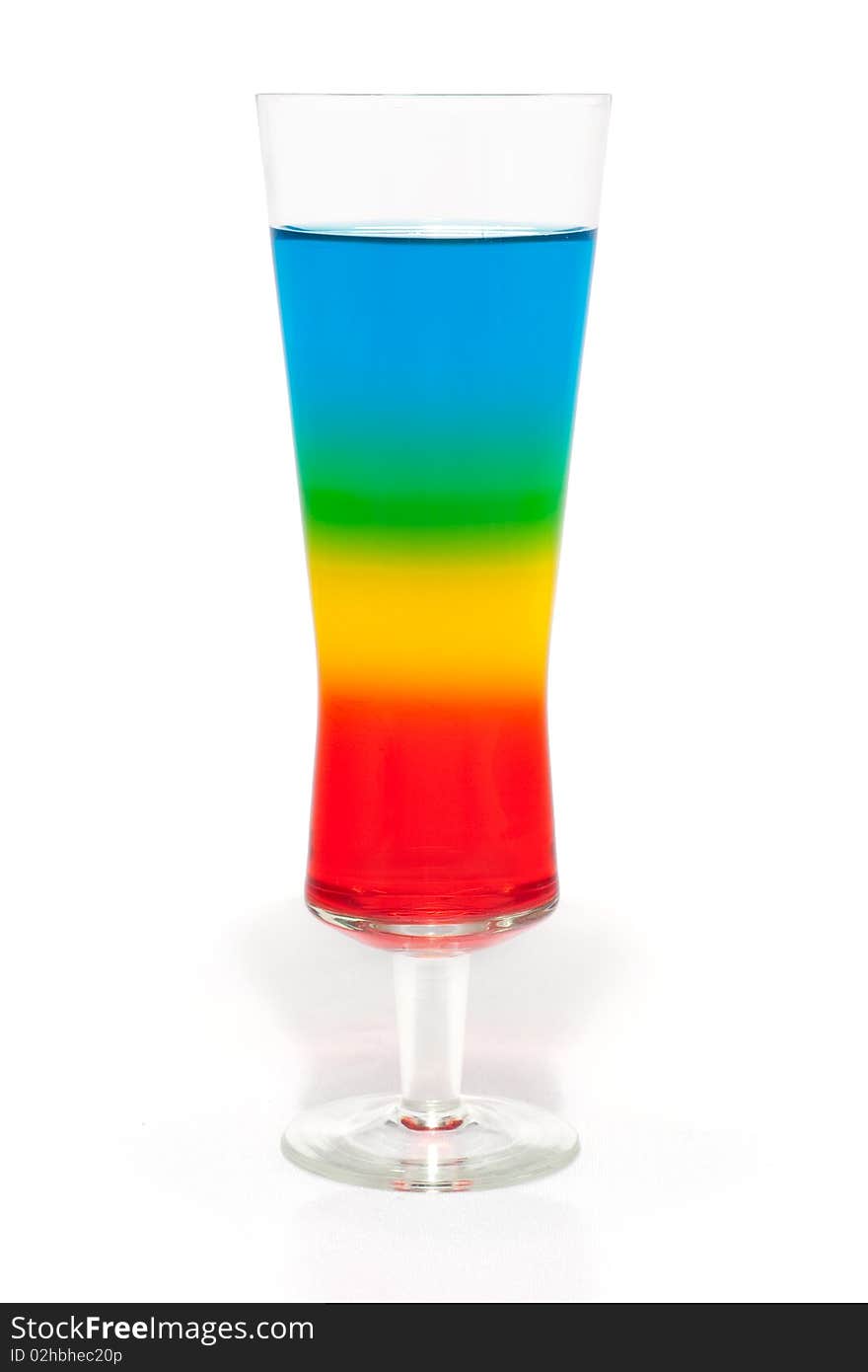 A colorful, layered cocktail  isolated on white. A colorful, layered cocktail  isolated on white