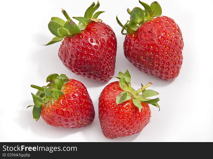 A group of isolated strawberries. A group of isolated strawberries