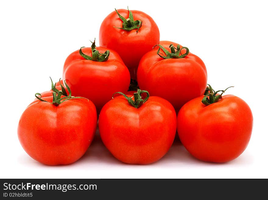 A few red tomatoes isolated on white. A few red tomatoes isolated on white