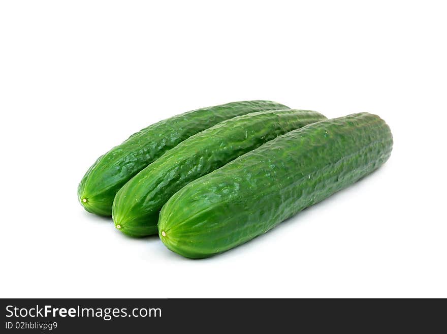 A fresh green cucumber isolated on a white background