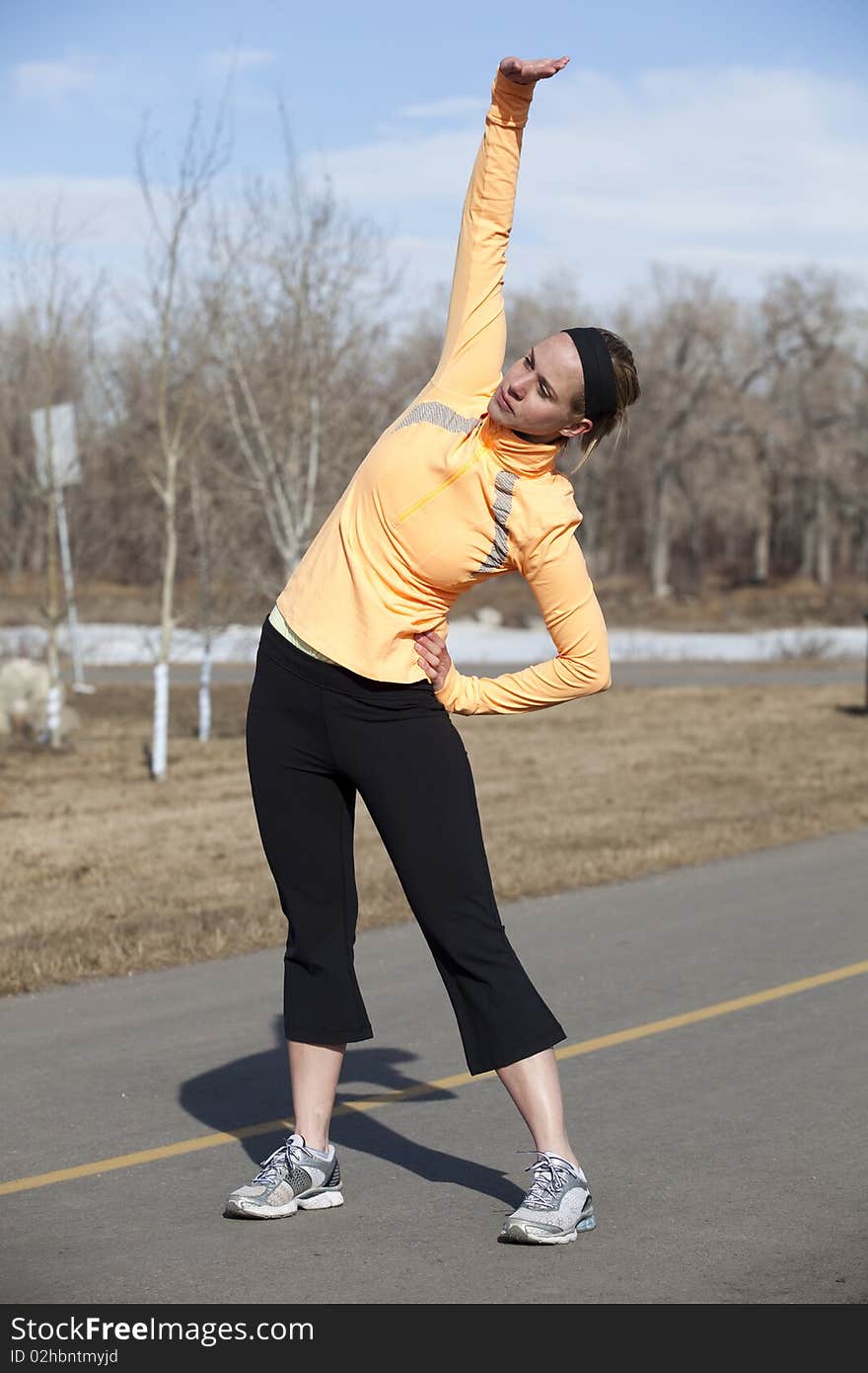 Young woman stretching after her workout