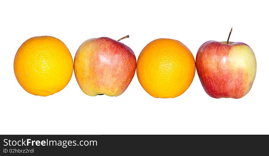 Two oranges and two apples photographed on a white background. Two oranges and two apples photographed on a white background