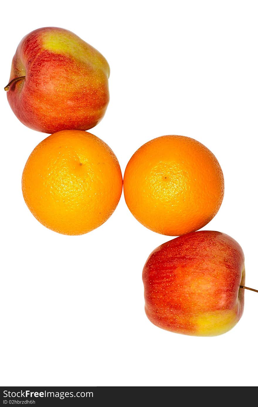 Two oranges and two apples photographed on a white background. Two oranges and two apples photographed on a white background