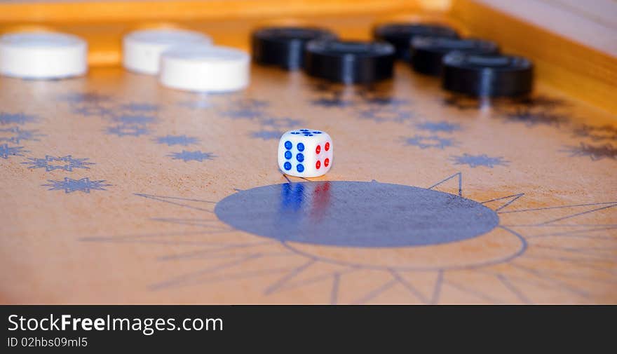 Playing cube on a board for game in a backgammon