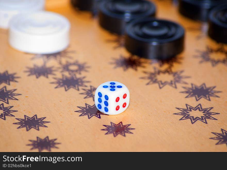 Playing cube on a board for game in a backgammon