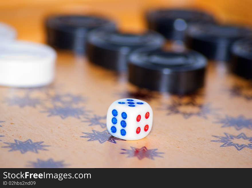 Playing cube on a board for game in a backgammon