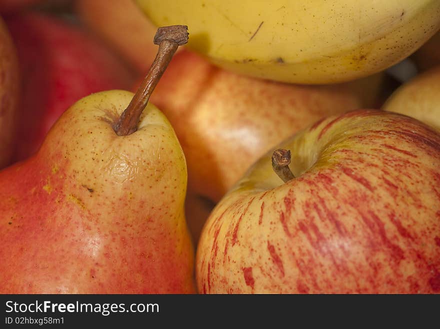 Closeup of a fruit basket with pears and apples