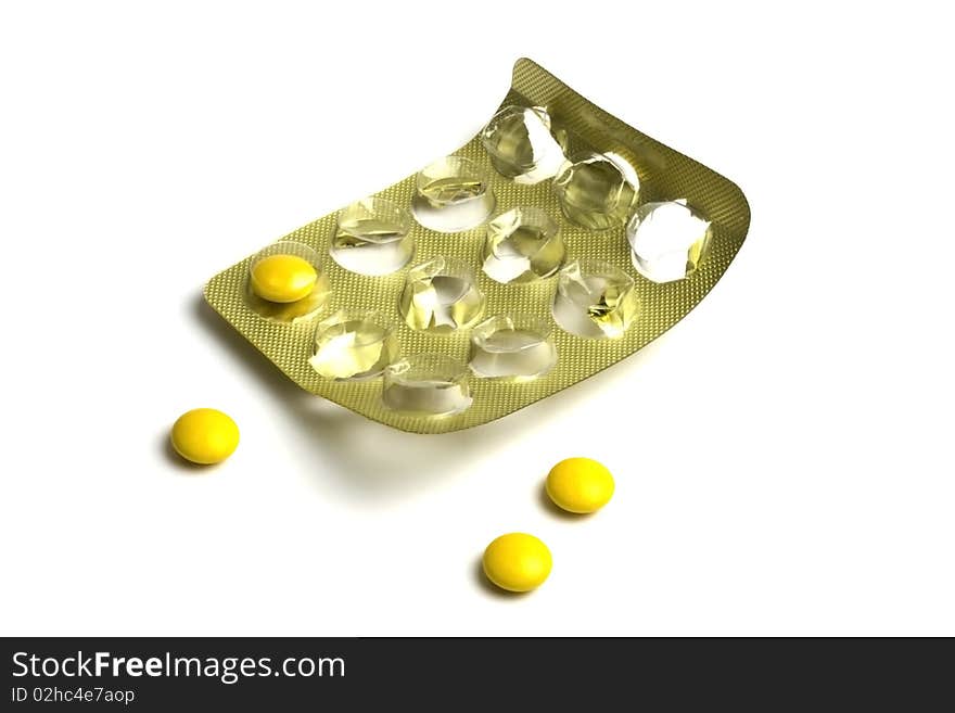 Package of Yellow Pills isolated on white