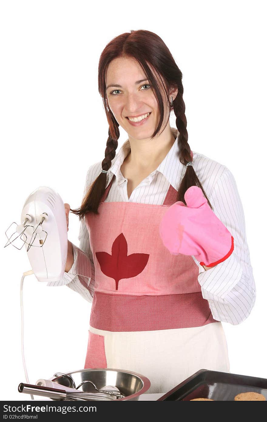 Beautiful housewife with electric beater on white background