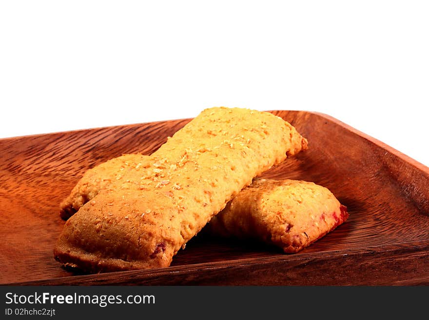 Light meal with fruit - Cereal Bar on a wood plate.