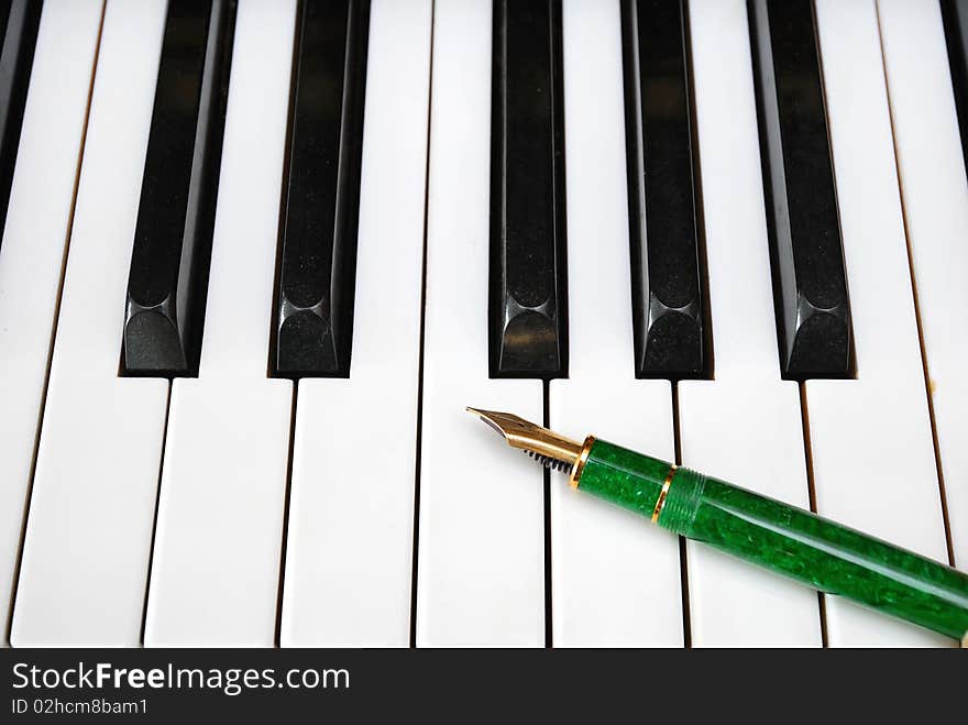 Fountain Pen On A Piano Keyboard