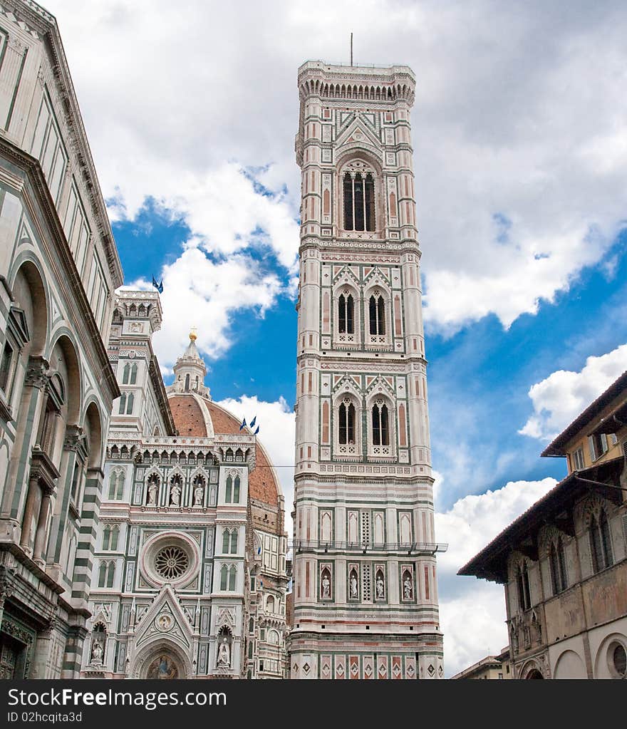 Italian tower over blue sky