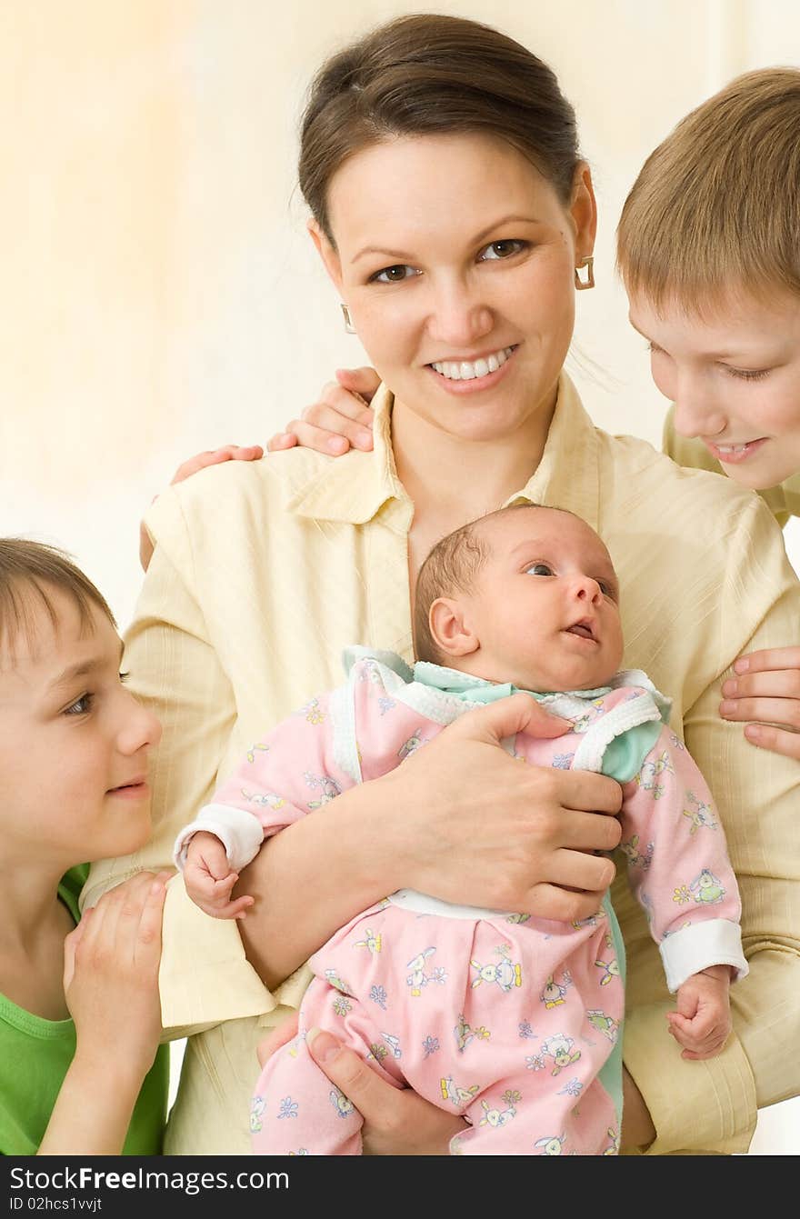 Happy mother with her three children. Happy mother with her three children