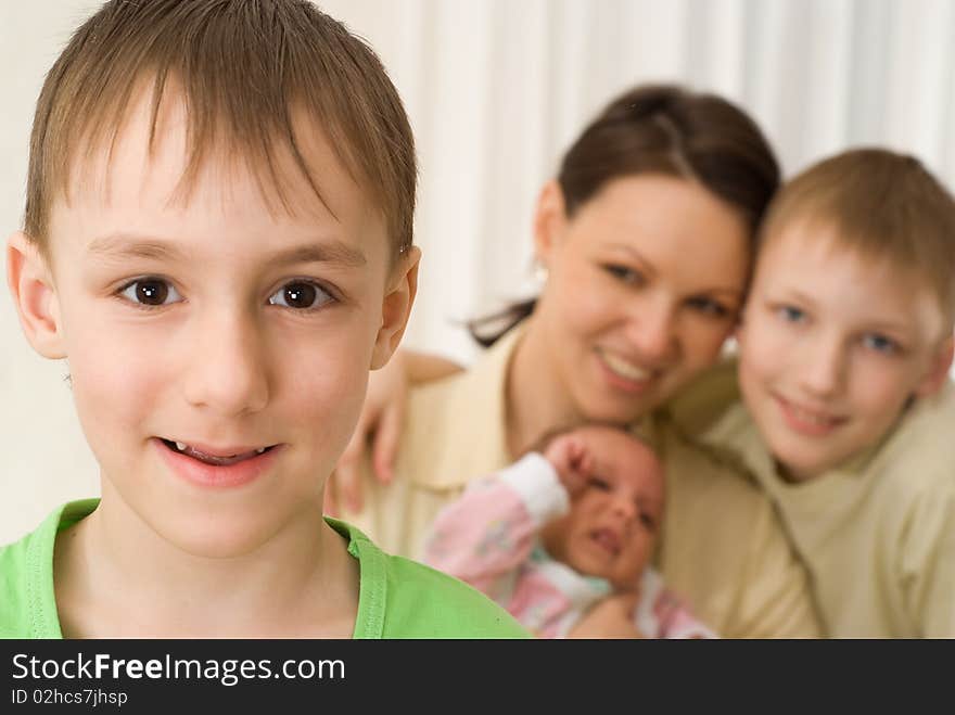 Handsome boy with his mother and brothers. Handsome boy with his mother and brothers