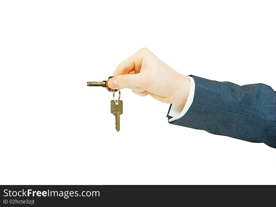 Hand holds a key isolated on white. Hand holds a key isolated on white