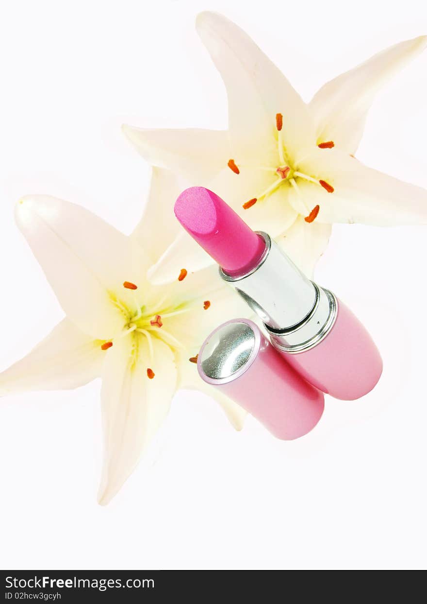 Red lipstick with pink lilies on background