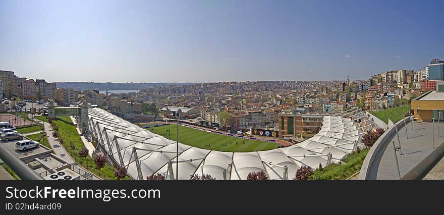 Panoramic view over a residential area of Istanbul, Turkey with a sports stadium in the foreground. Panoramic view over a residential area of Istanbul, Turkey with a sports stadium in the foreground