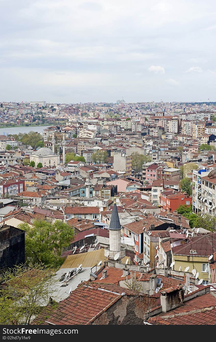 Cityscape view over a large residential area with a main river through the centre. Cityscape view over a large residential area with a main river through the centre