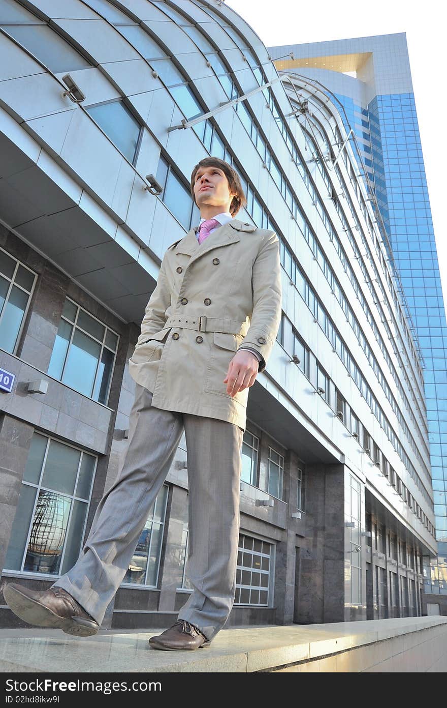 The business man goes against a skyscraper in Moscow of city