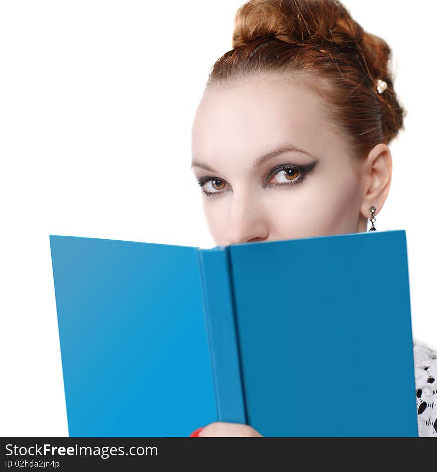 Portrait of attractive young woman with blue book