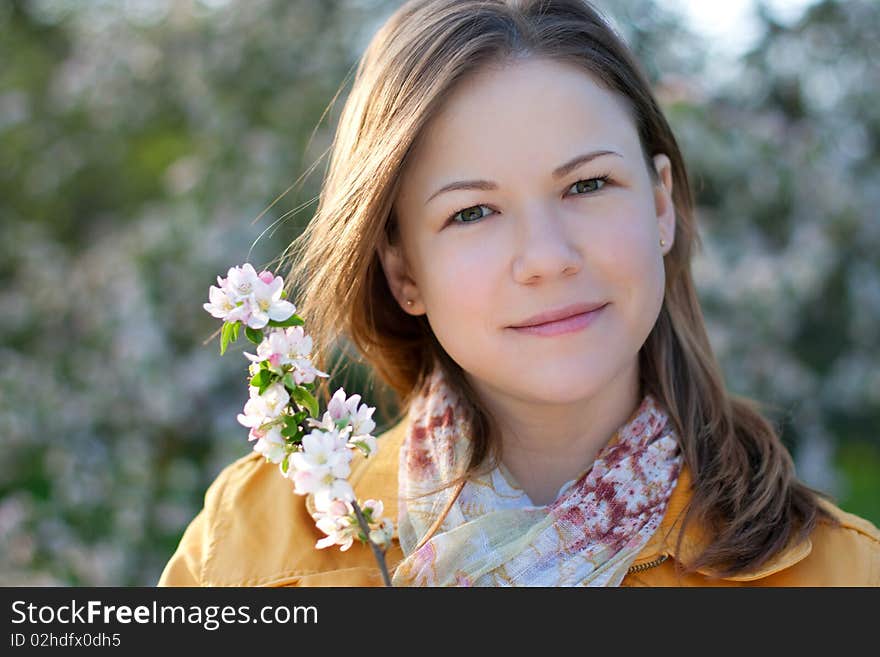 Young Woman In Blooming Park